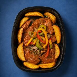 Saucy Masala Steak topped with Peppers and Mushrooms